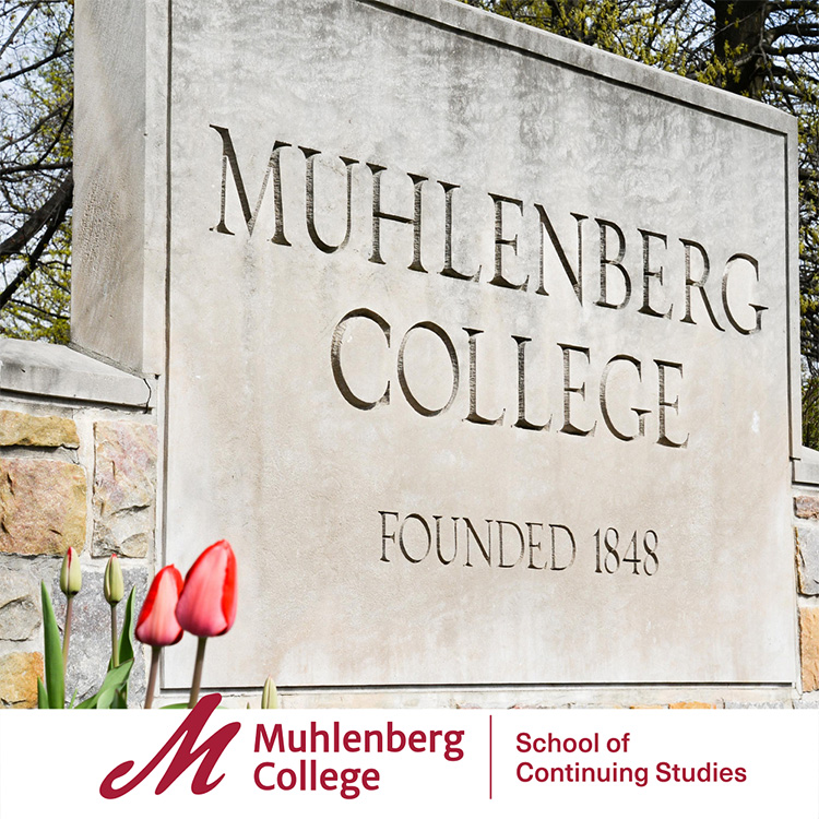 Stone engraved Muhlenberg College sign image taken in Spring season.