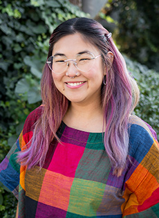 Portrait image of Advanced Counseling Trainee, Katy Kithcart, standing in outdoor setting.