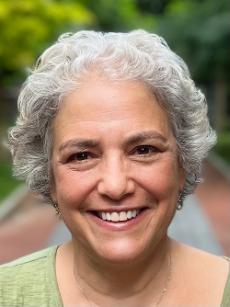 Close-up image of woman smiling.