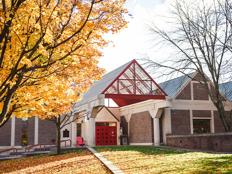 Muhlenberg's Trexler Library surrounded by bright yellow fall foliage.