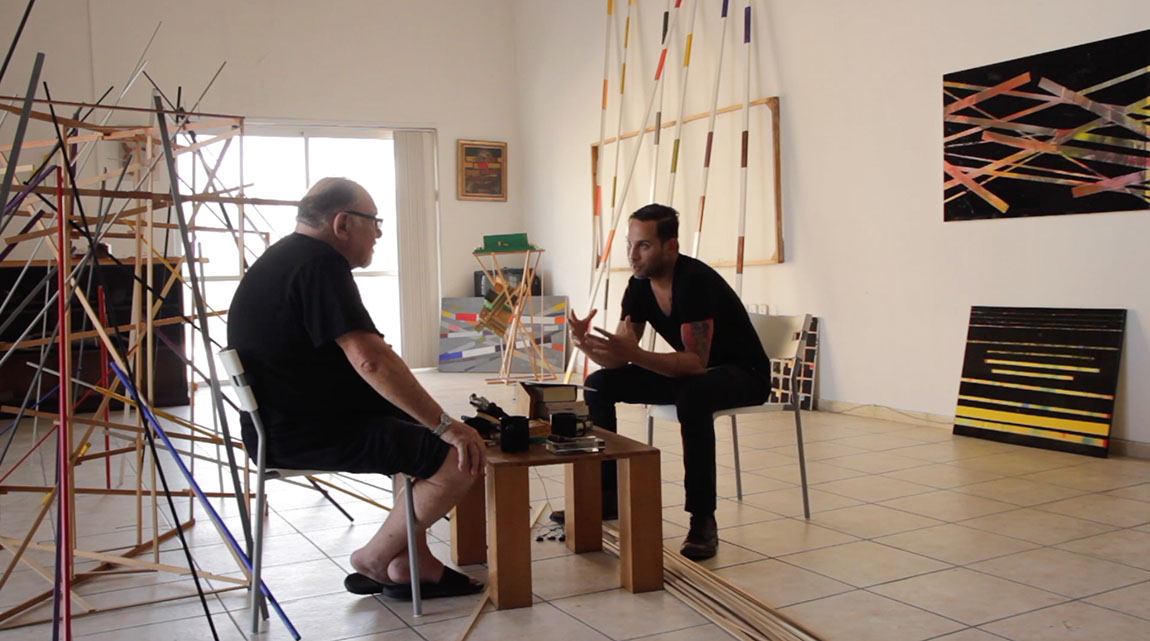 A college professor interviews his older father in an art studio