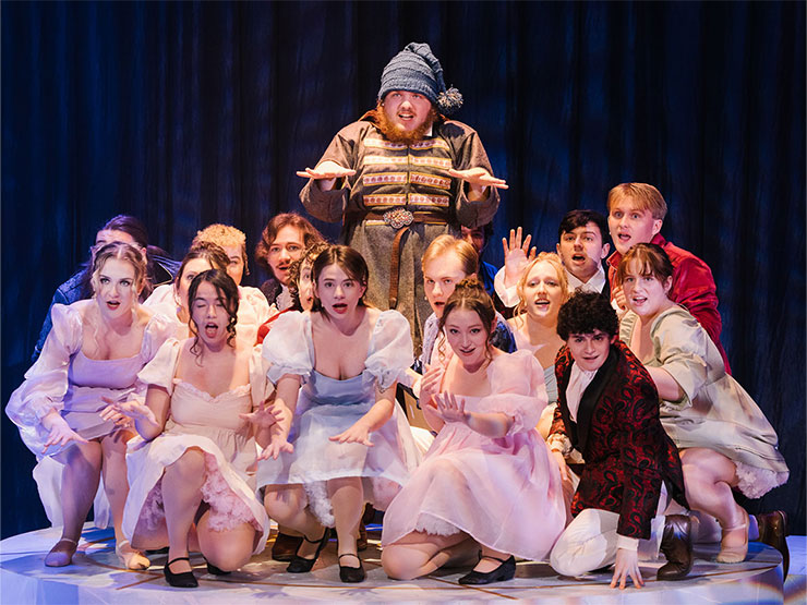 A group of college students sing while dressed in costume during a performance of Natasha, Pierre & the Great Comet of 1812